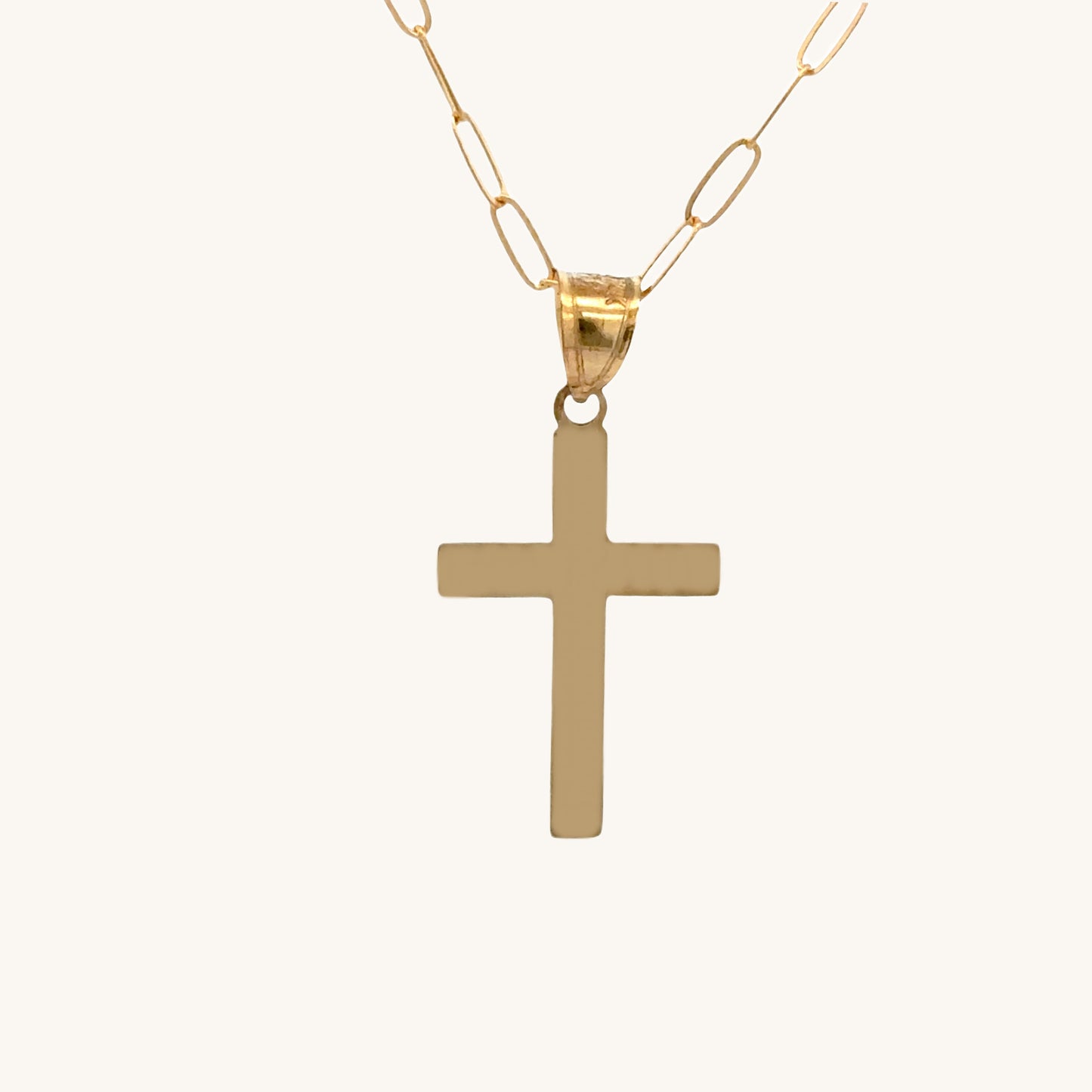Small 14K double‑bonded gold simple cross pendant high‑polish finish on 16-18" paperclip chain back image