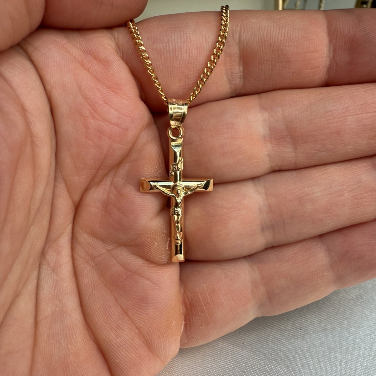 Solid 14K Double Bonded Gold INRI Crucifix M Pendant Only lifestyle close up in hand image