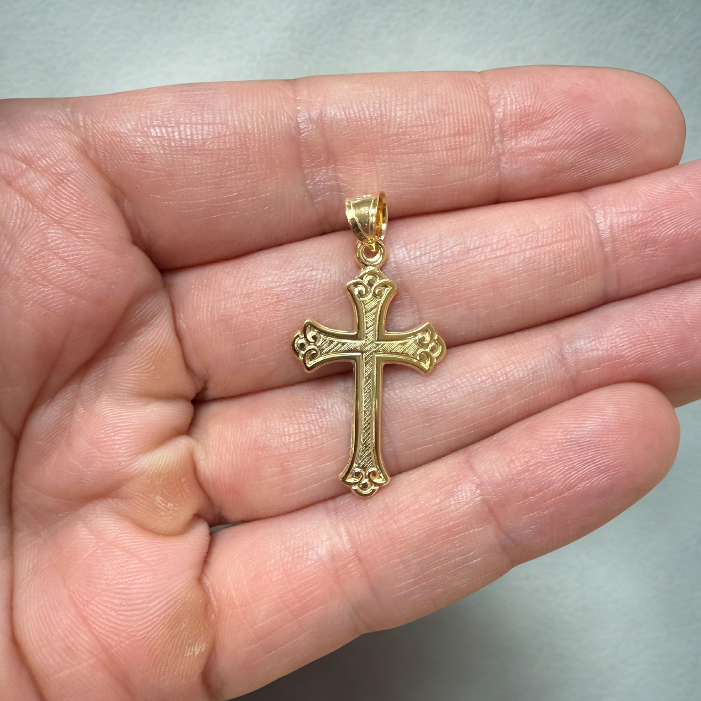 Solid 14K Double Bonded Gold Ornate Cross Pendant Only M S lifestyle close up image