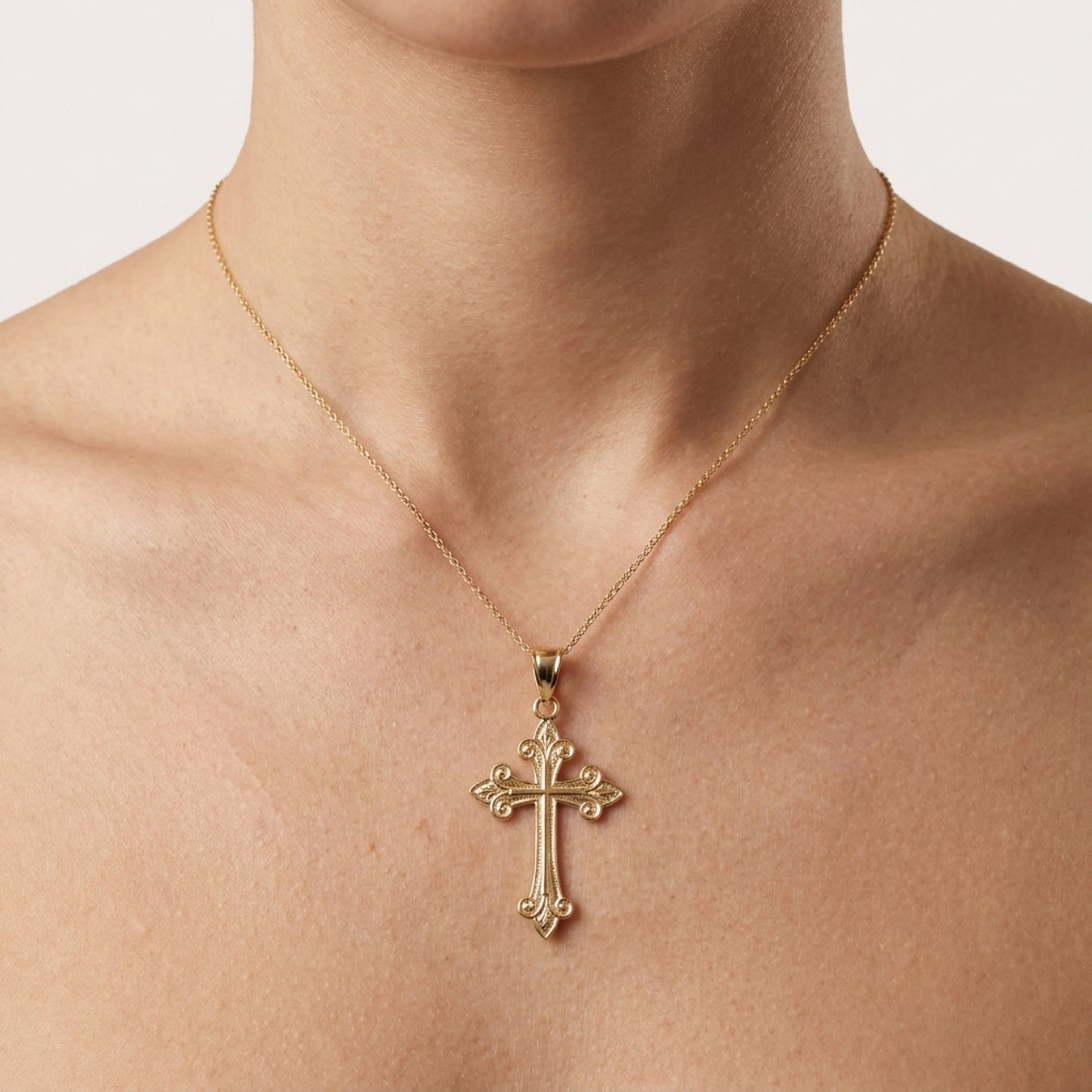 Solid 14K Double Bonded Gold Fleur Cross pendant only lifestyle image on woman L