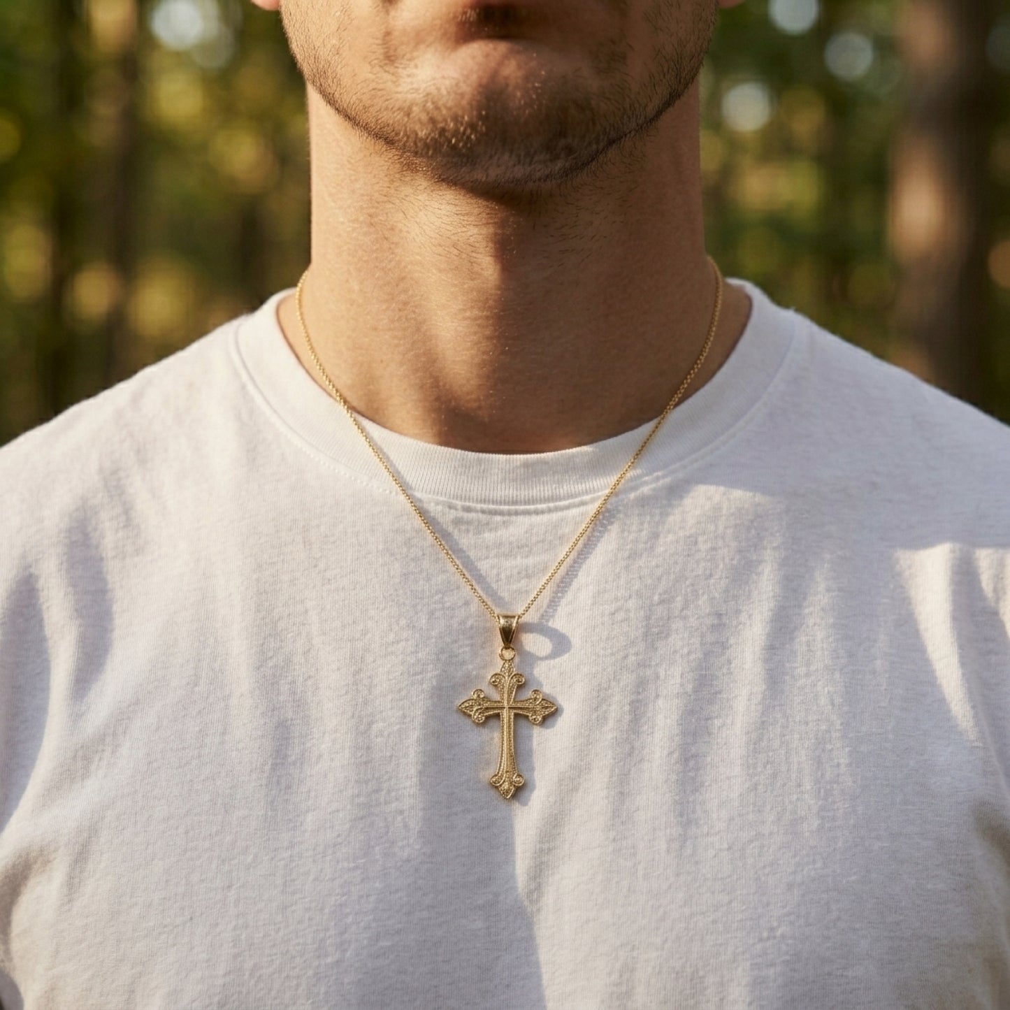Solid 14K Double Bonded Gold Fleur Cross pendant only lifestyle image on man L
