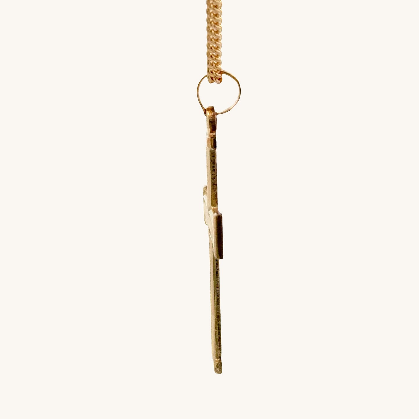14K double‑bonded gold Cross pendant with texture design high‑polish finish on cable chain side image