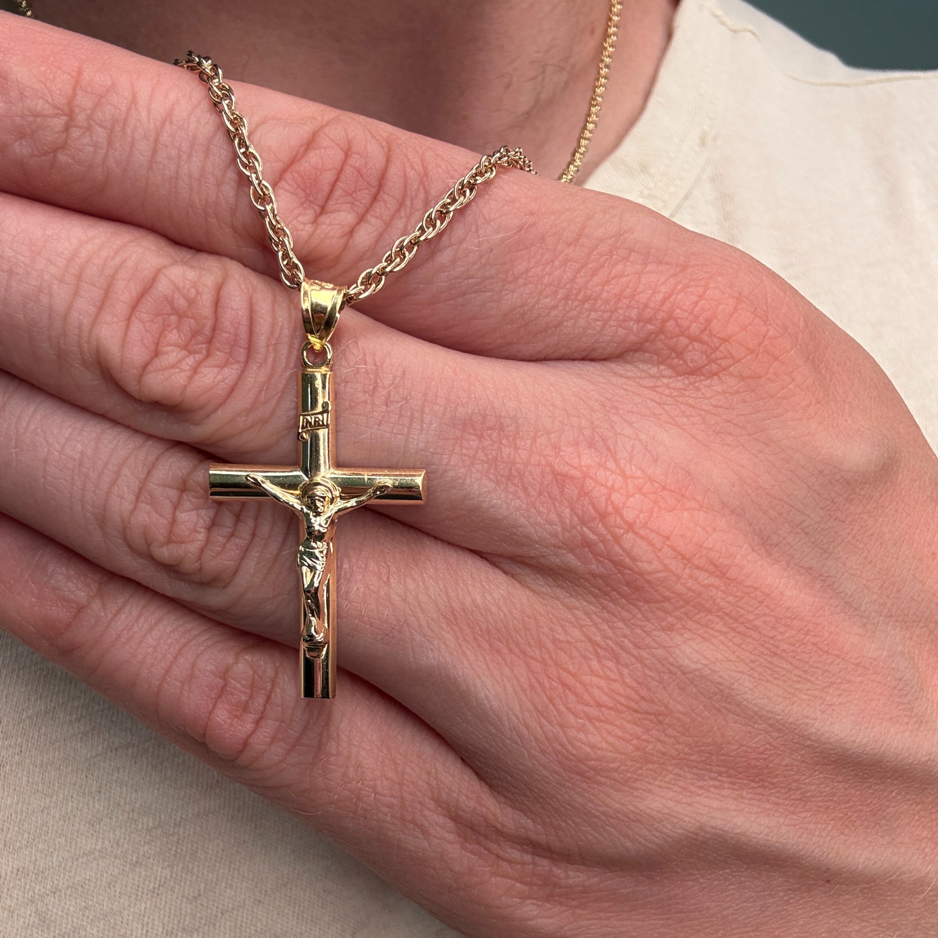 Solid 14K Double Bonded Gold INRI Crucifix pendant on rope chain main lifestyle close up image