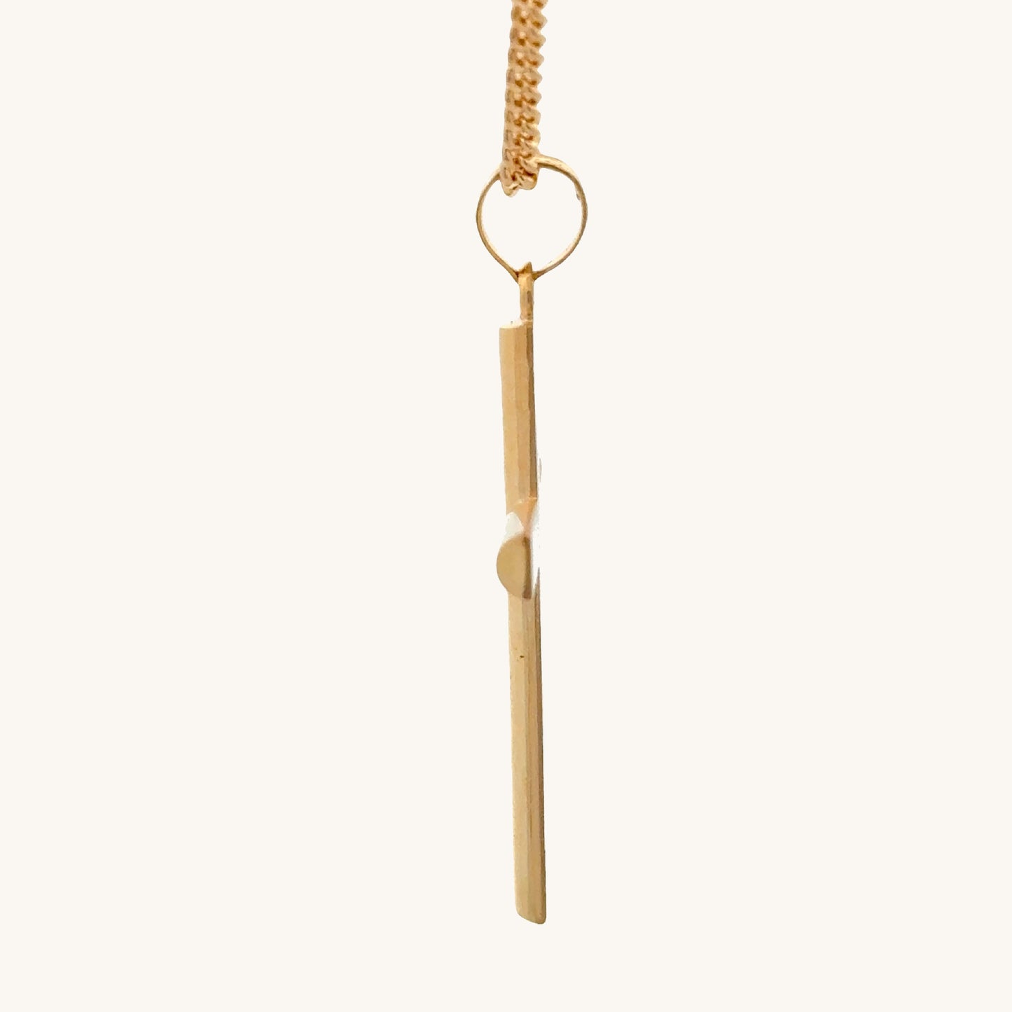 14K Double Bonded Gold Tube cross pendant on a gold filled cable chain against a white background side image
