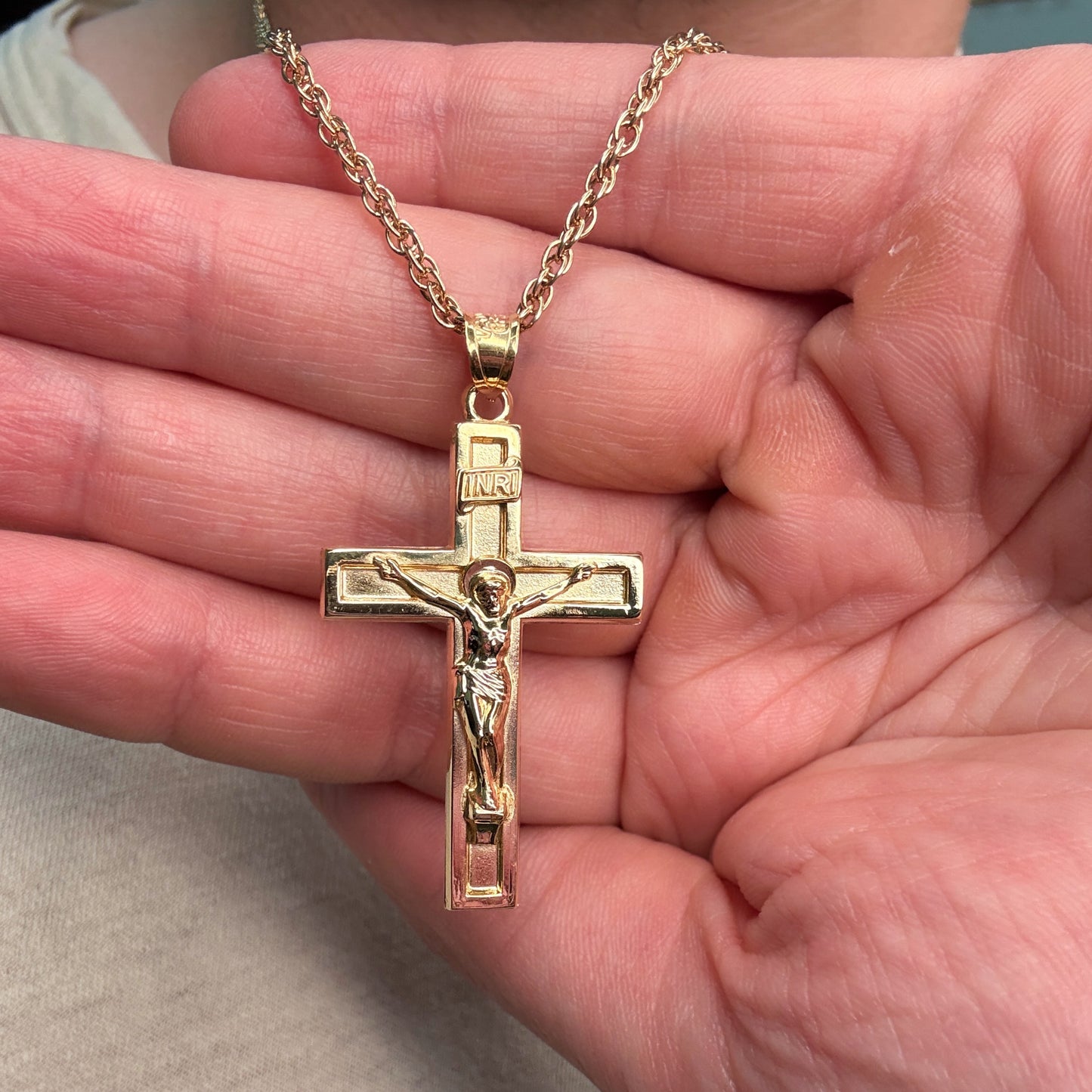 Solid 14K Double Bonded Gold XXL plain polished INRI Crucifix cross pendant on a rope chain lifestyle close up