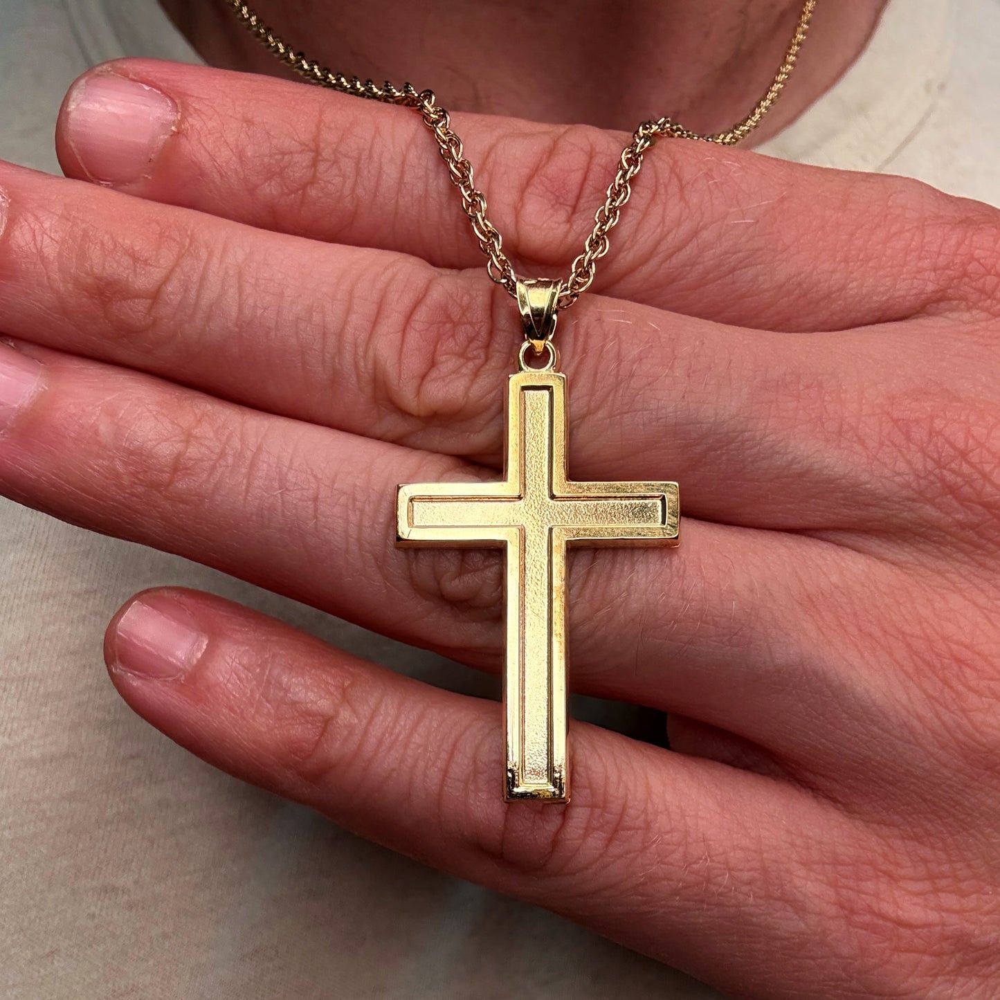 Solid 14K Double Bonded Gold XXL plain polished Cross pendant on a rope chain close up image