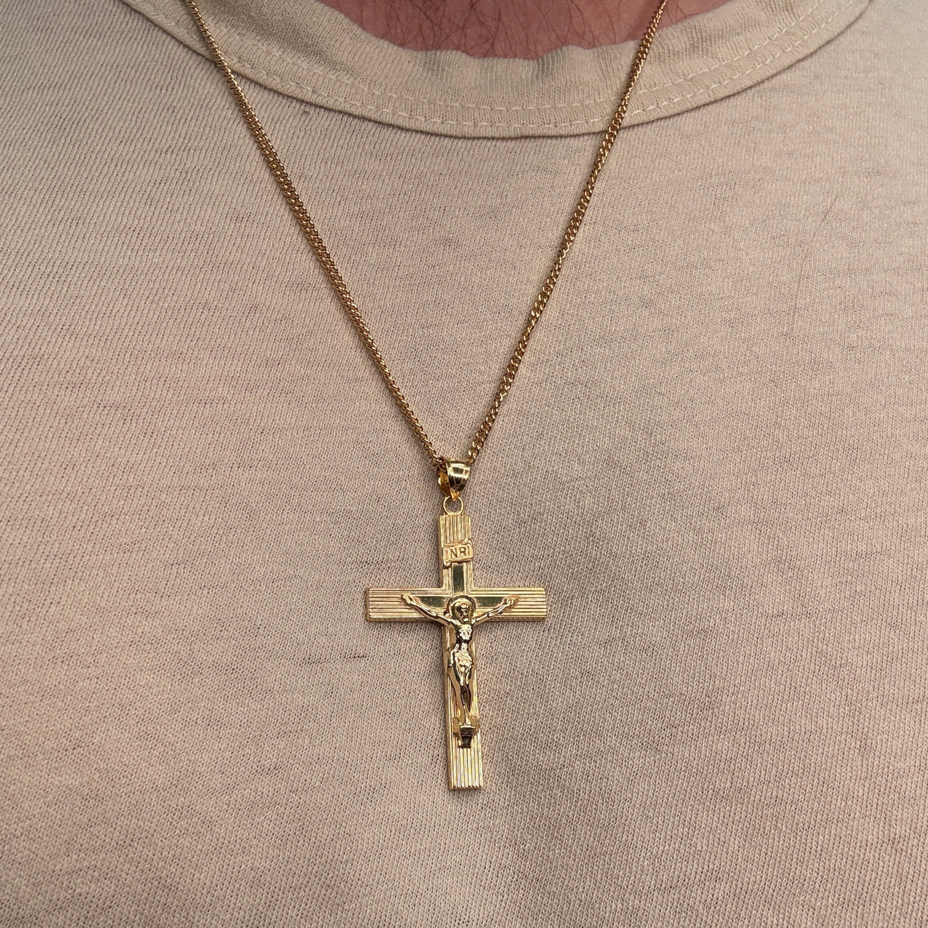 XXL 14K double‑bonded gold INRI crucifix pendant with engine‑turned texture and high‑polish finish on 22" Cable chain being worn image