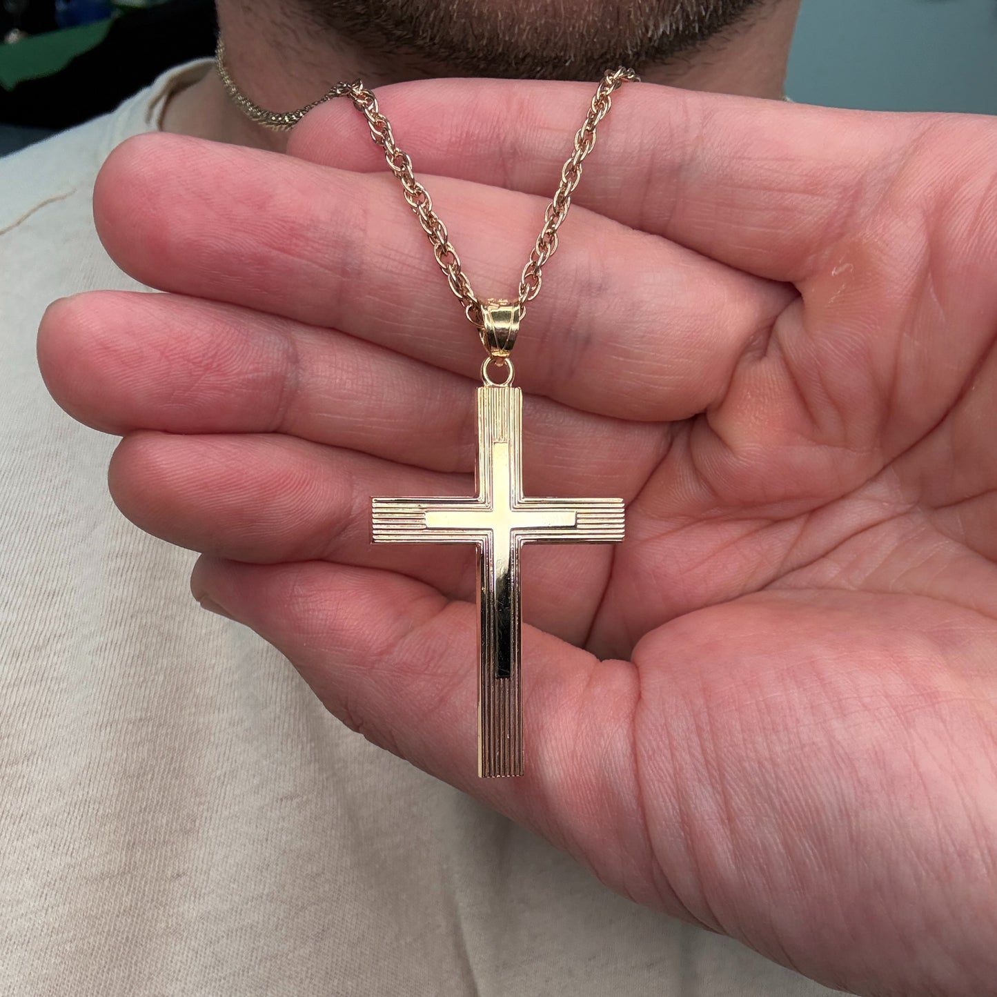 Solid 14K Double Bonded Gold XXL Engine-Turn design Cross pendant on a cable chain close up image
