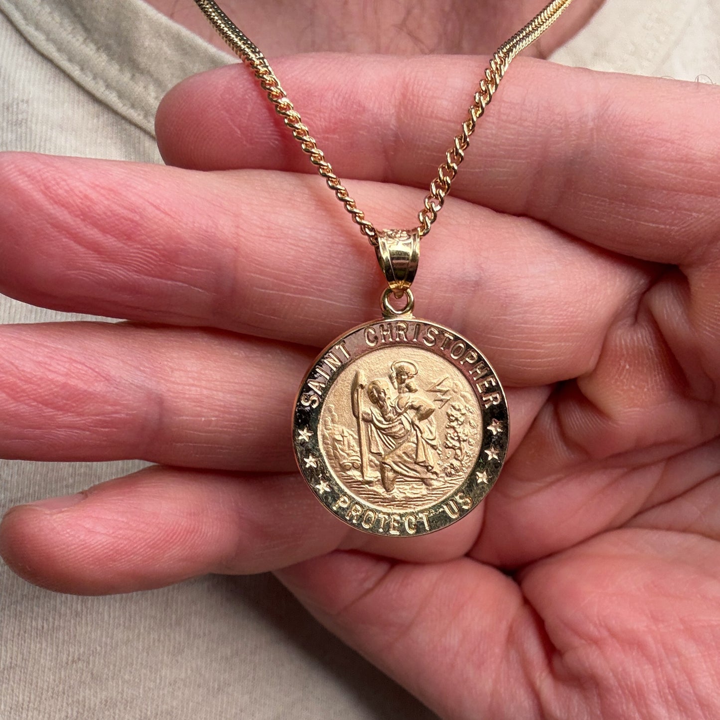 Solid 14K Double Bonded Gold Saint Christopher Medal XL (size of Quarter) L (size of Nickel) M (size of Dime) size on cable chain lifestyle close up image