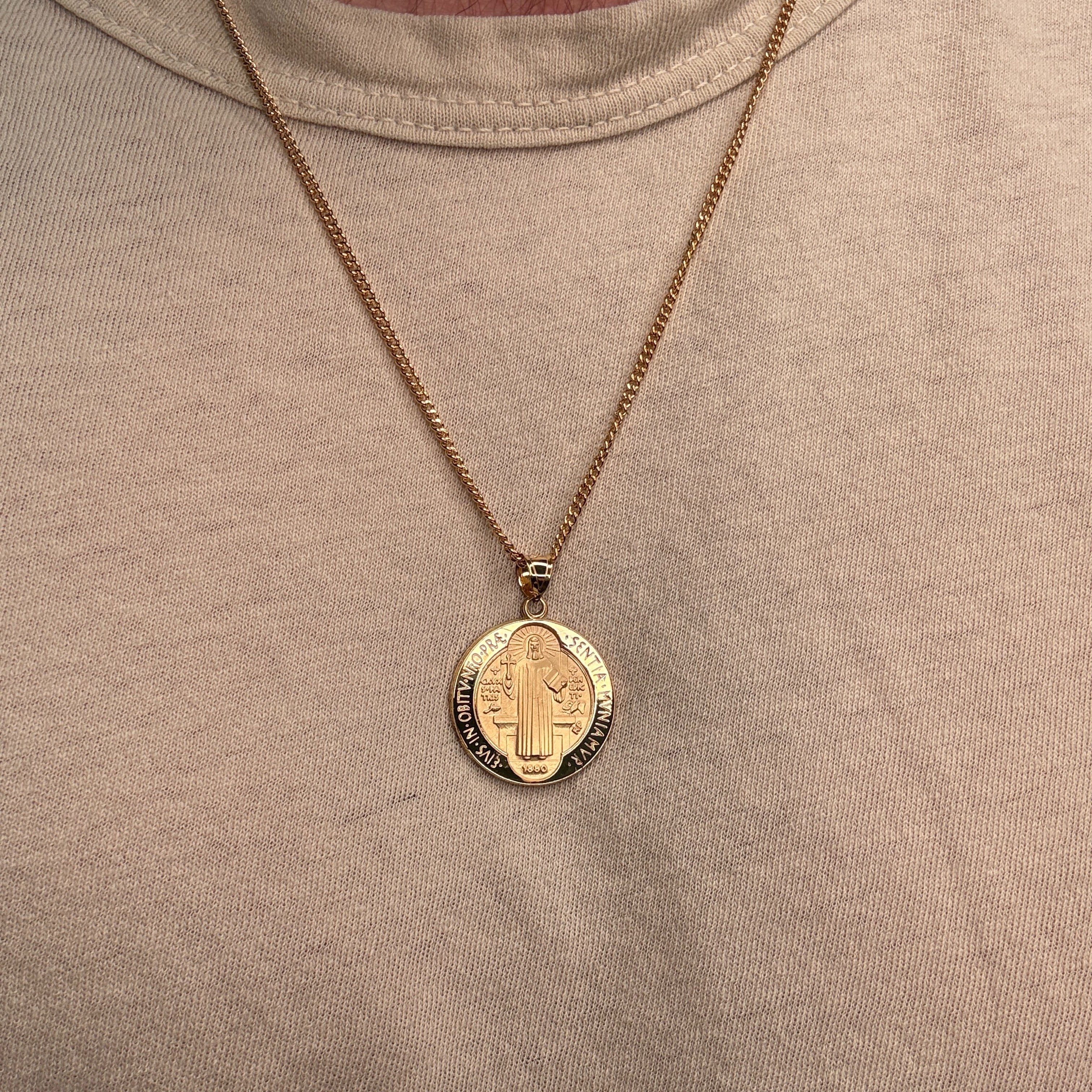 Solid 14K Double Bonded Gold Saint Benedict pendant medal on cable chain lifestyle image being worn L (size of Nickel) M (size of Dime)
