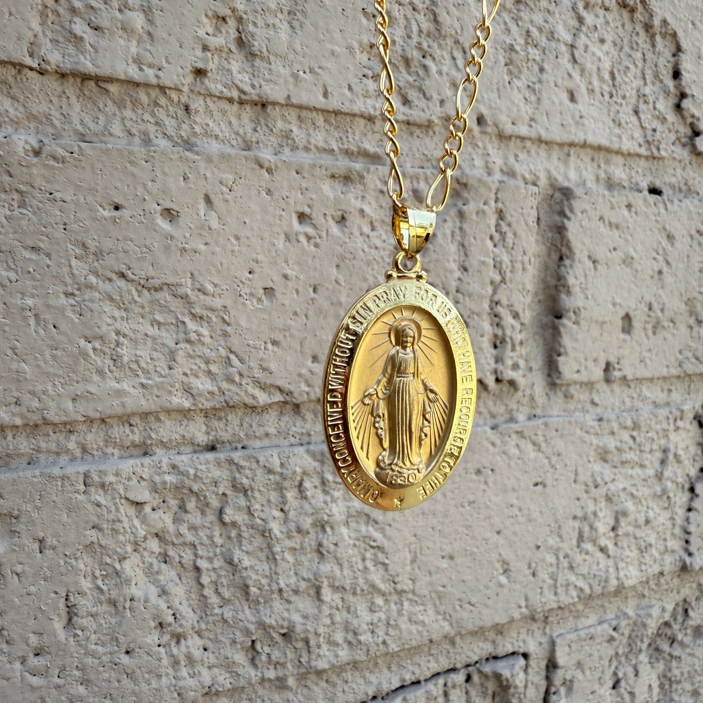 14K Double Bonded Gold Miraculous Virgin Mary oval medal necklace on figaro chain main image S XL Pendant + 22" Figaro Chain lifestyle image