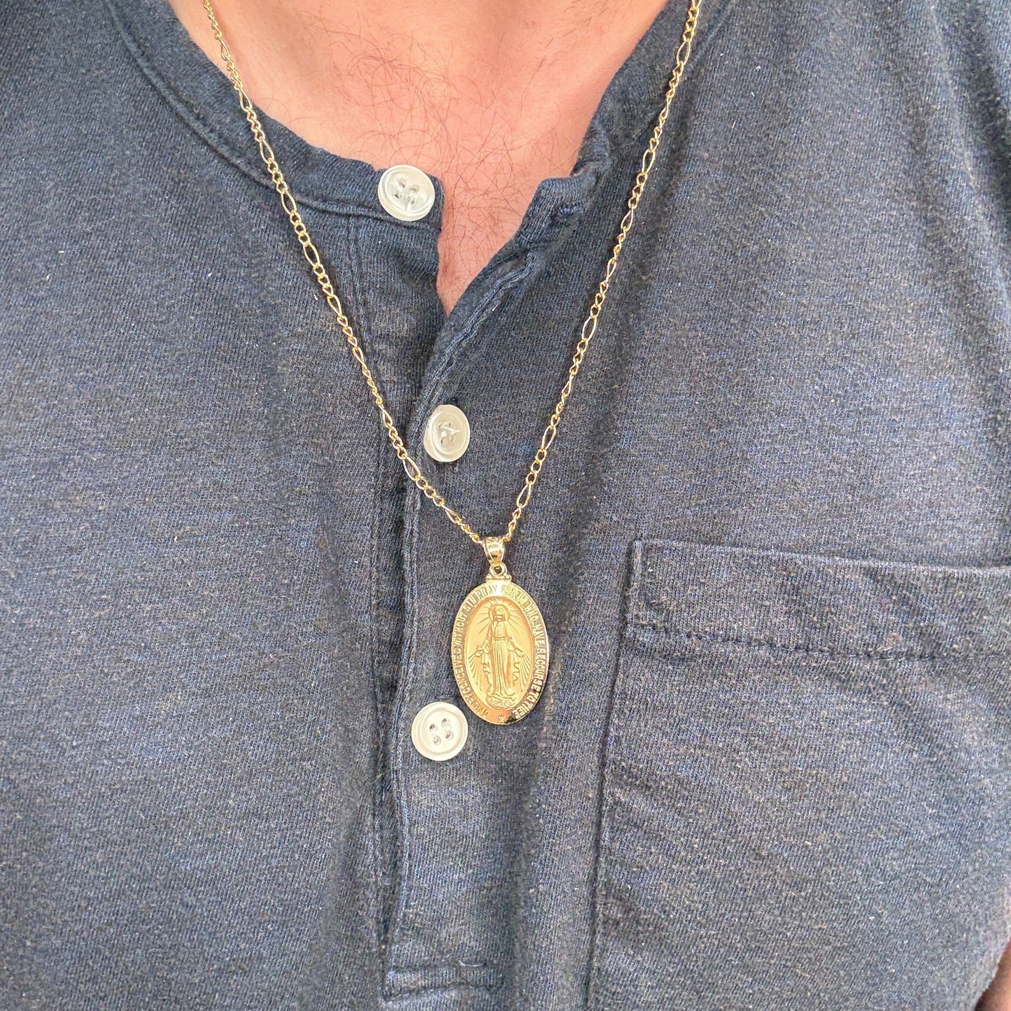 14K Double Bonded Gold Miraculous Virgin Mary oval medal necklace on figaro chain main image S XL Pendant + 22" Figaro Chain lifestyle image on man