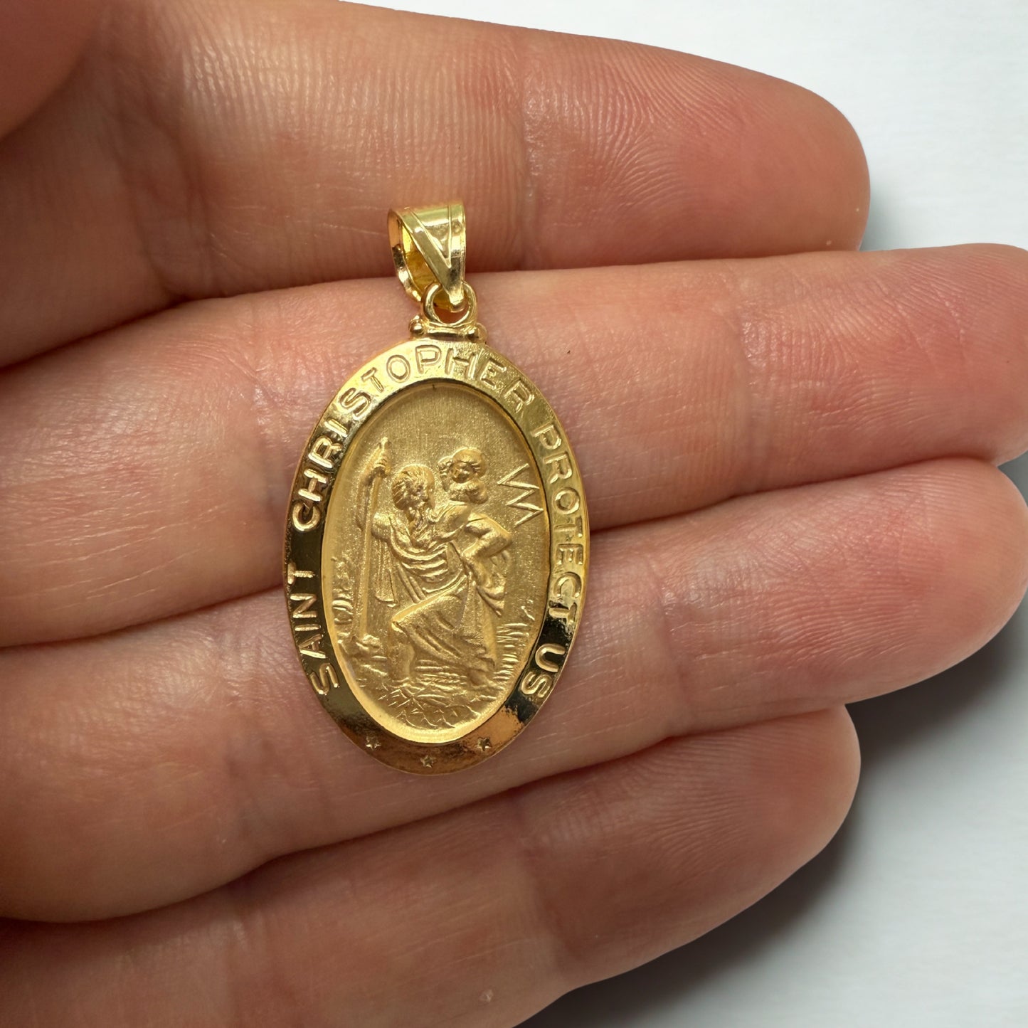 Solid 14K Double Bonded Gold Saint Christopher oval medal pendant lifestyle close up image