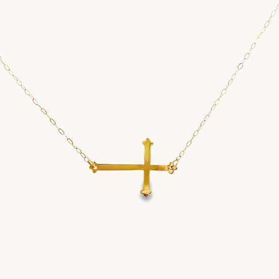Solid 14K Yellow Gold Sideways Cross Necklace on 18" chain. A modern symbol of faith, handcrafted in the USA. Elegant, meaningful, and heirloom quality front image